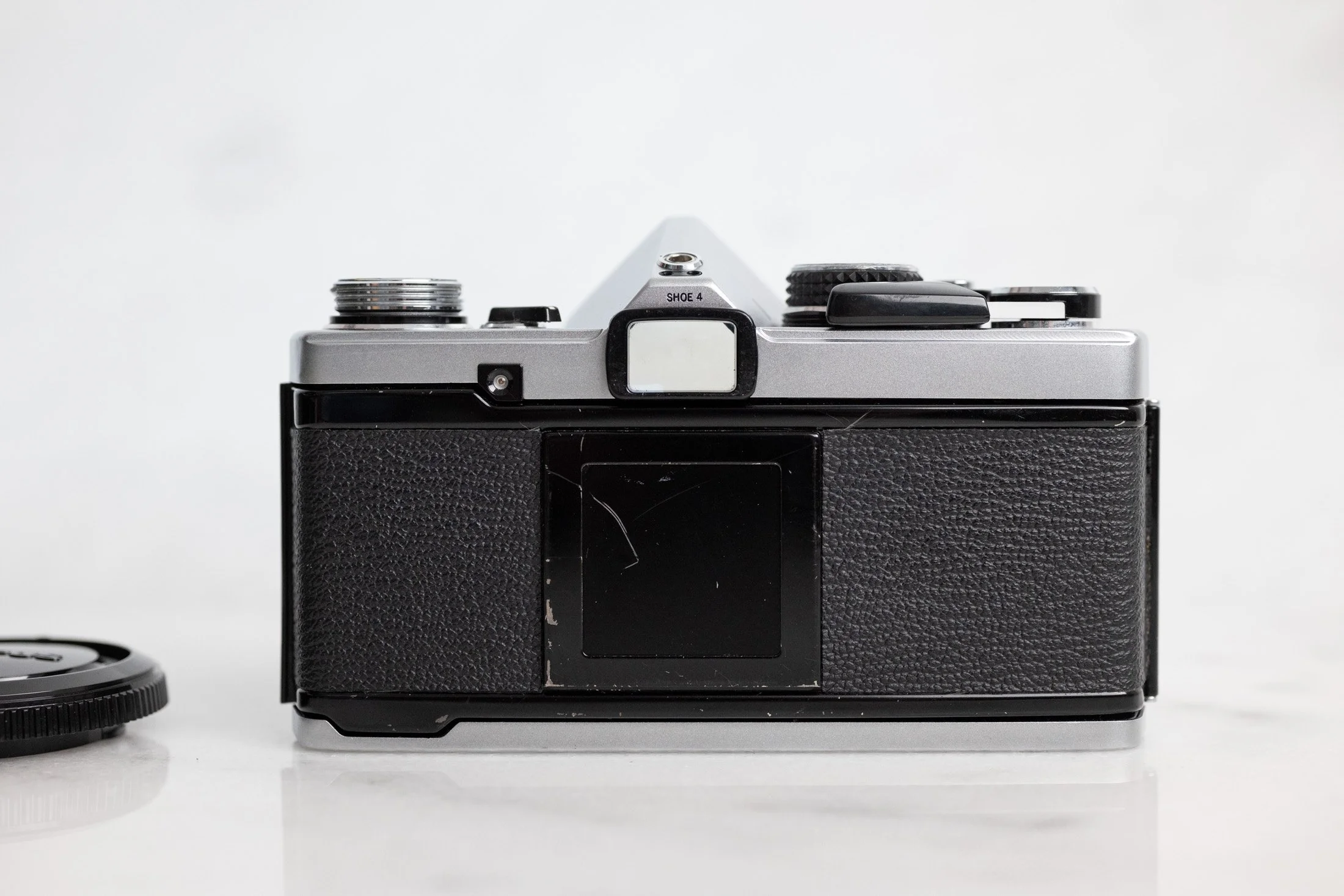 Olympus OM-2n 35mm Film SLR Camera with Body Cap and New Batteries